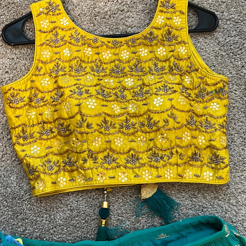 Embroidered yellow blouse with silk thread georgette lagenga and net chunni.